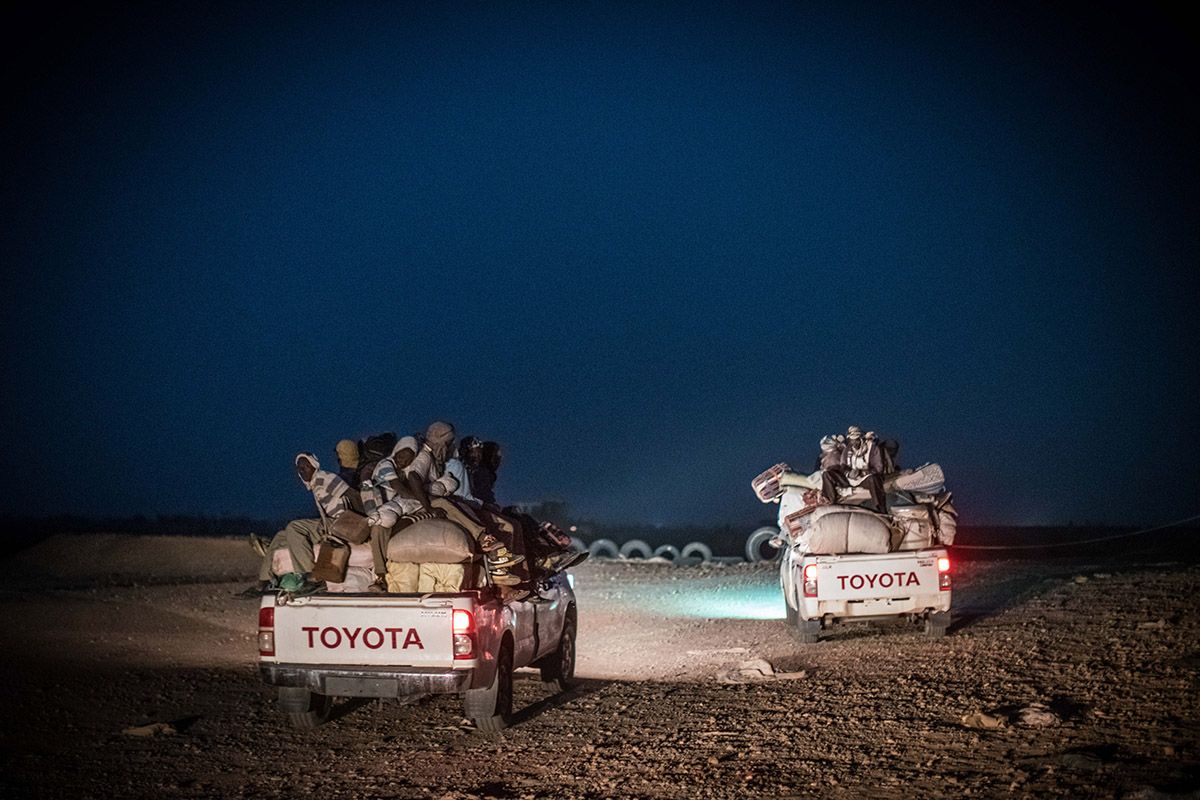 Trucks carrying migrants leave Agadez headed for the open desert. Image by Nichole Sobecki. Niger, 2017.