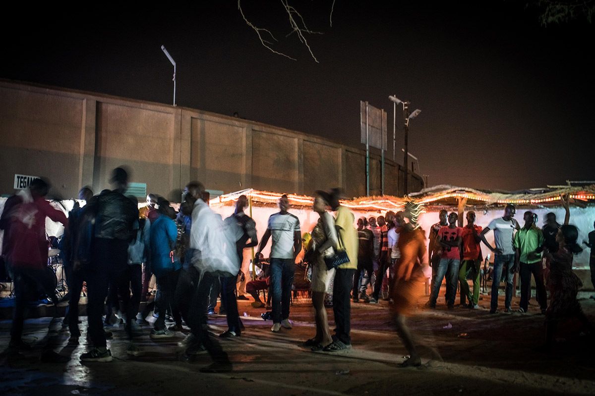 Men and women dance late into the night at a club in Agadez playing live Hausa music. Niger’s EU-funded crackdown on migration has hit the economy of Agadez hard, slowing the city’s famously fast-paced nightlife down considerably. Image by Nichole Sobecki. Niger, 2017.