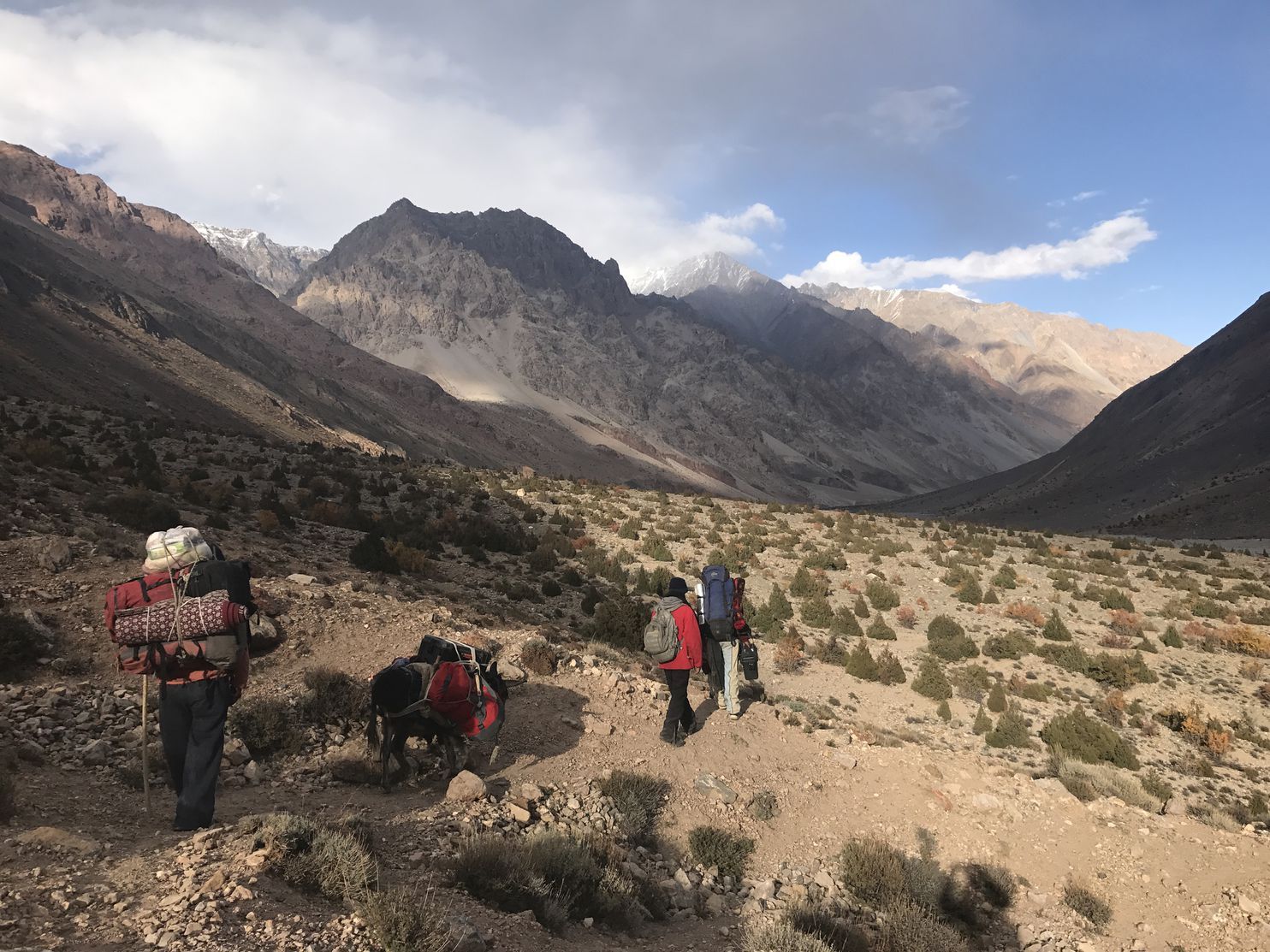 Journalist Paul Salopek took this photo of guides and walking partners in 2017 as the group entered the Gilgit-Baltistan region of Pakistan. Salopek is on what he calls the Out of Eden Walk, a years-long journey to trace the path of human migration. He started the walk in 2013, and originally planned to finish this year. He has realized he needs more time to practice “slow journalism” — seeing, listening and experiencing new things. Image by Paul Salopek. Pakistan, 2017.