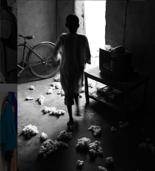The Gira family brings cotton into the warehouse in their home in Boromo. Image by Jost Franko. Burkina Faso, 2016. 