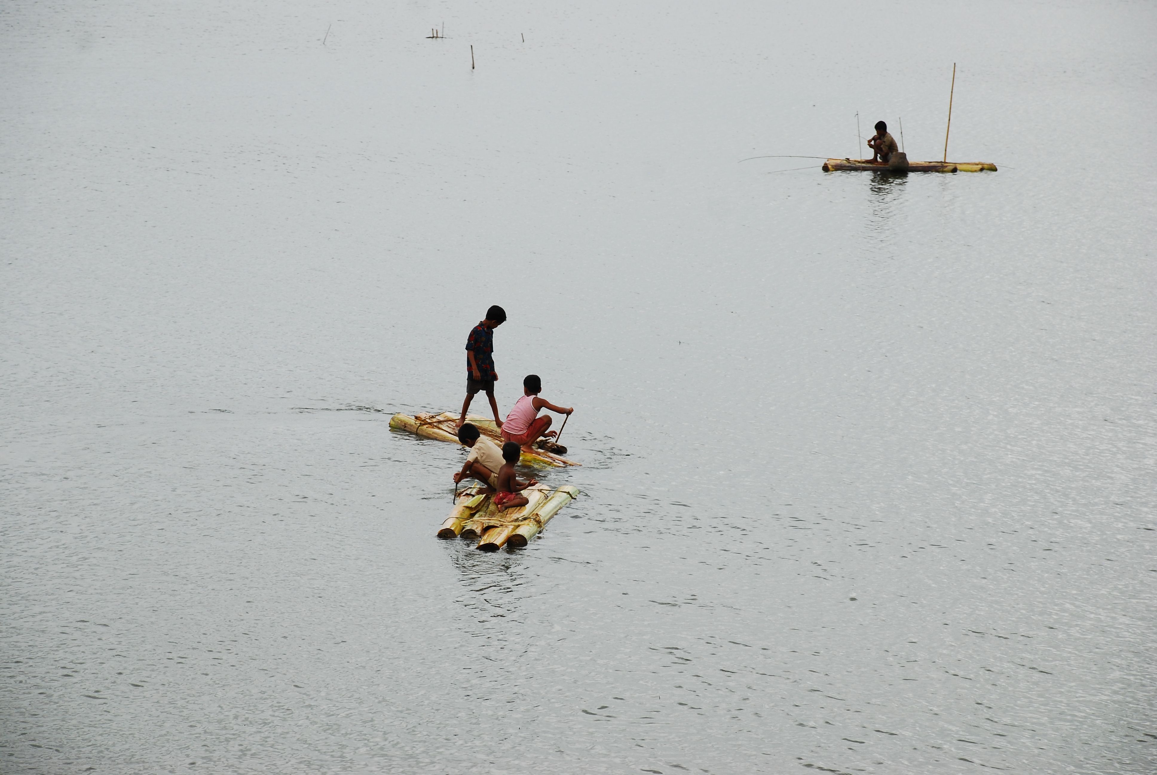 Children play with old rafts over flooded fields in rural Bangladesh. Image by Amir Jina / CC. Bangladesh, 2009.