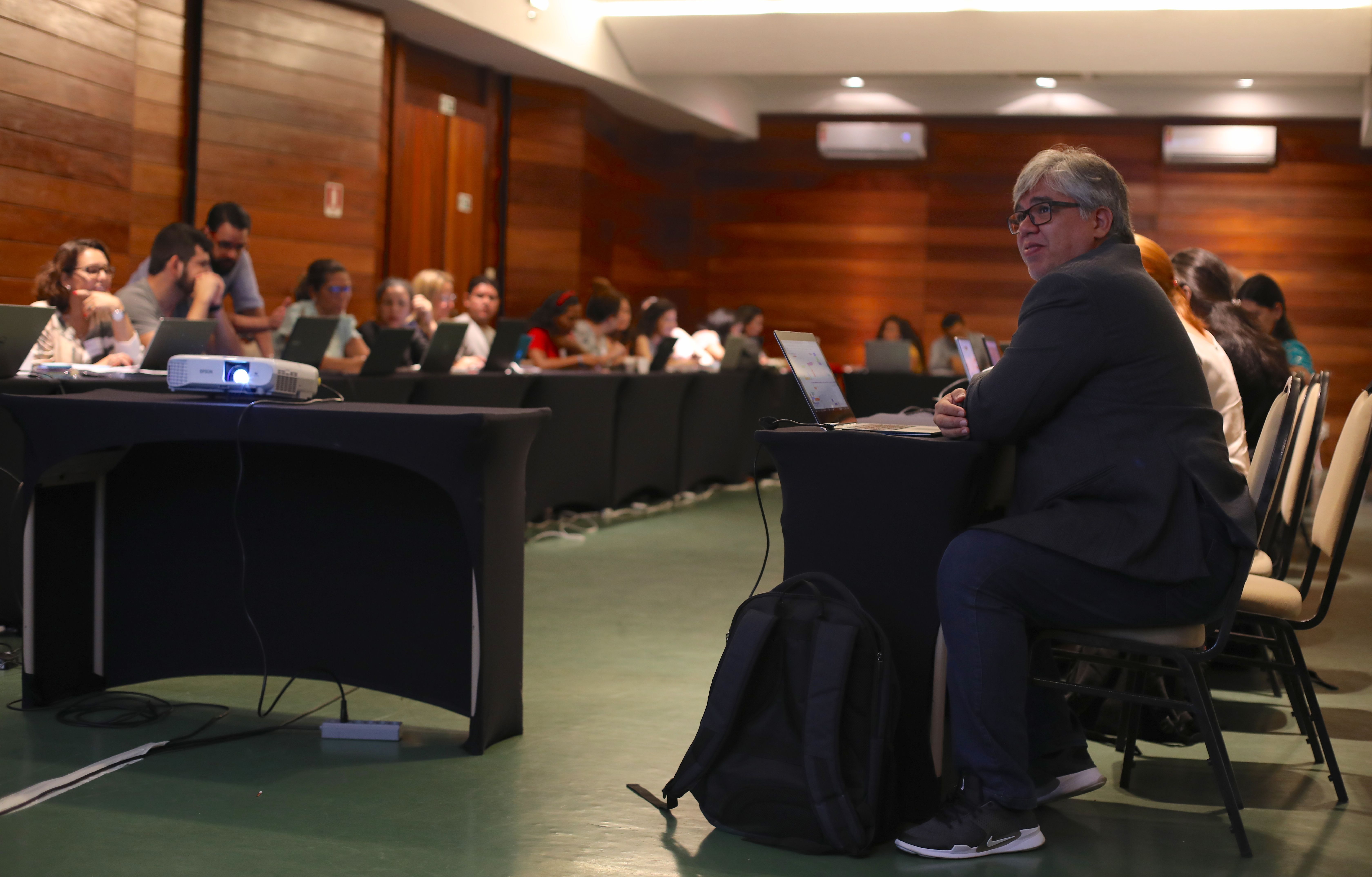 Dr. Claudio Salgado, president of the Brazilian Leprosy Society, listens to a presentation during the first day of the Laboratory of Dermatology Immunology’s brainstorming conference. Image by Anton L. Delgado. Brazil, 2020.