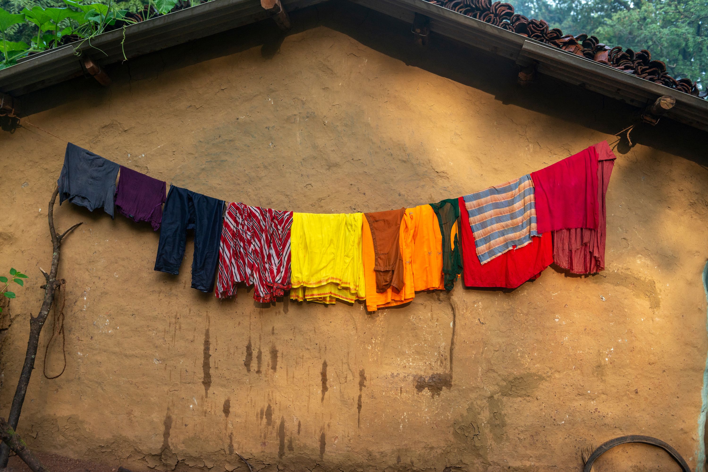 Clothes drying outside a house in the Bastar district. Image by Amitrane / Shutterstock. India, 2016.