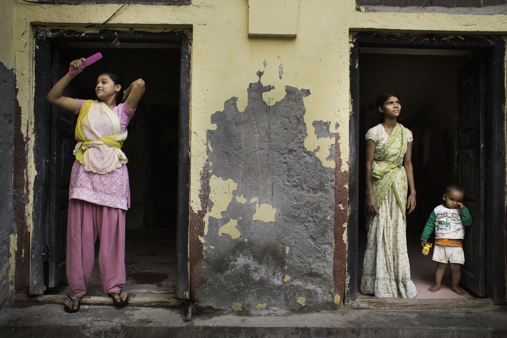 Teenage girls outside Tarash Mandir, a short-stay home for young women and permanent facility for elderly widows in Vrindavan, India.