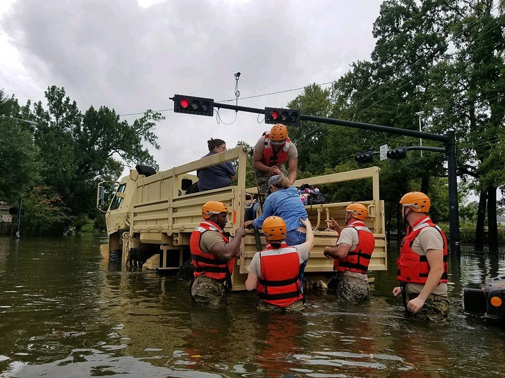 Texas National Guard soldiers rescue a civilian in flooded areas around Houston, Texas, on 27 August, 2017. Image by 1Lt. Zachary West, 100th MPAD. United States, 2017.