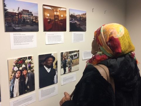 Guests of Hardy Middle School student journalists engage with students' reporting at the Pulitzer Center-hosted exhibition of their "Walk Like a Journalist" work. Image by Fareed Mostoufi. Washington, D.C, 2017. 