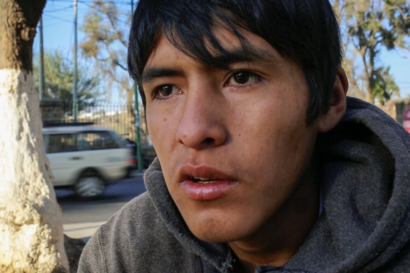 Jonathan Gutierrez, 19, said "family problems" led him to drugs. "I smoke cocaine, pot. I sniff glue, gasoline, everything. I get derailed. I get back on track, then I fall off again." Image by Tracey Eaton. Bolivia, 2017.