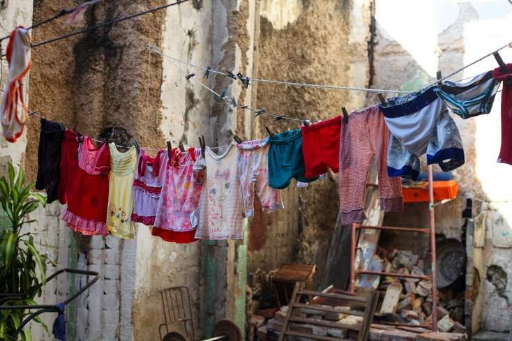Clothes hang at the San Ignacio Street shelter in Havana. Image by Katherine Lewin. Cuba, 2019.