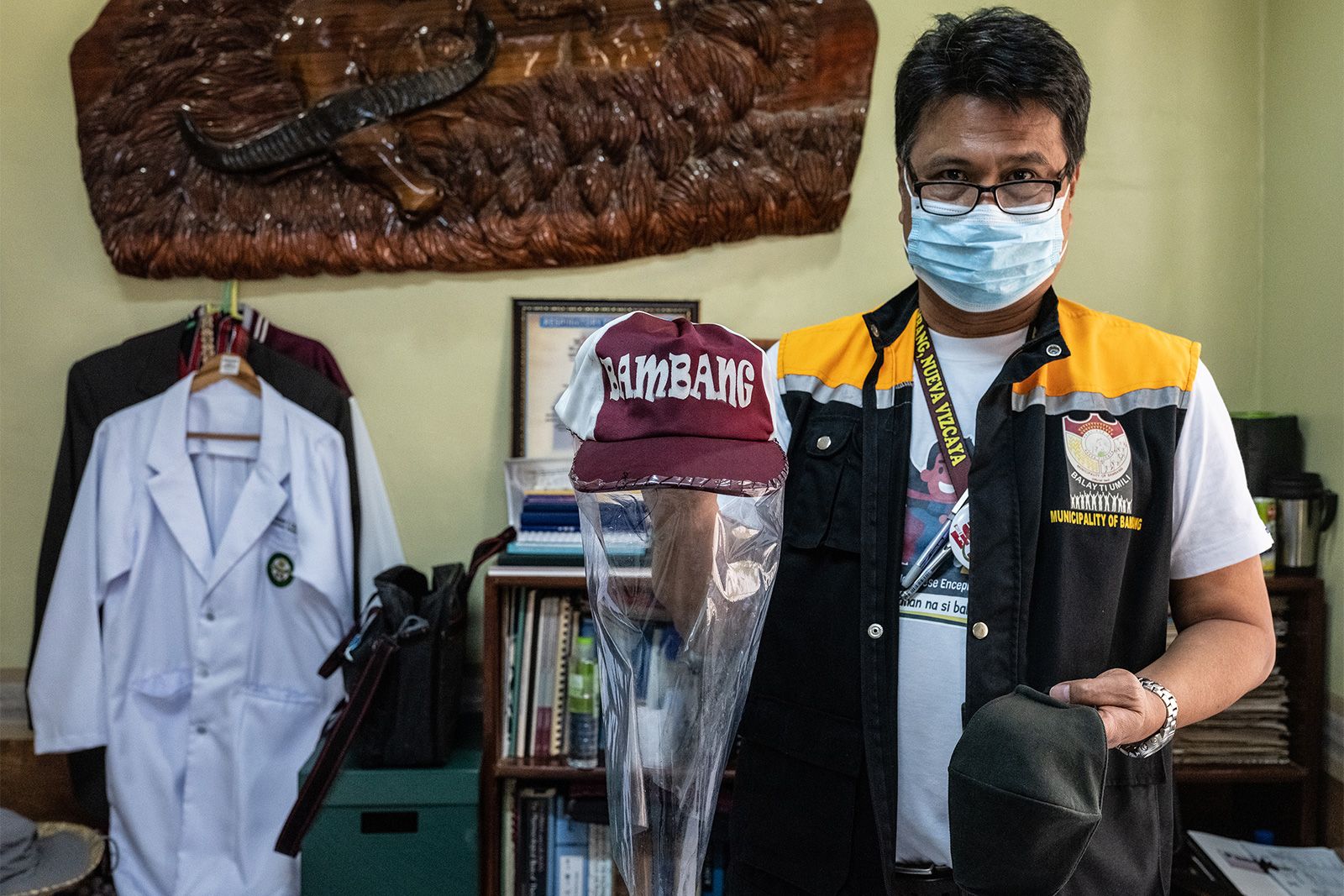 Dr. Anthony Cortez shows the temporary face protection equipment he has made. He said medics are hoping for the new personal protective equipment. Image by Xyza Cruz Bacani. Philippines, 2020.