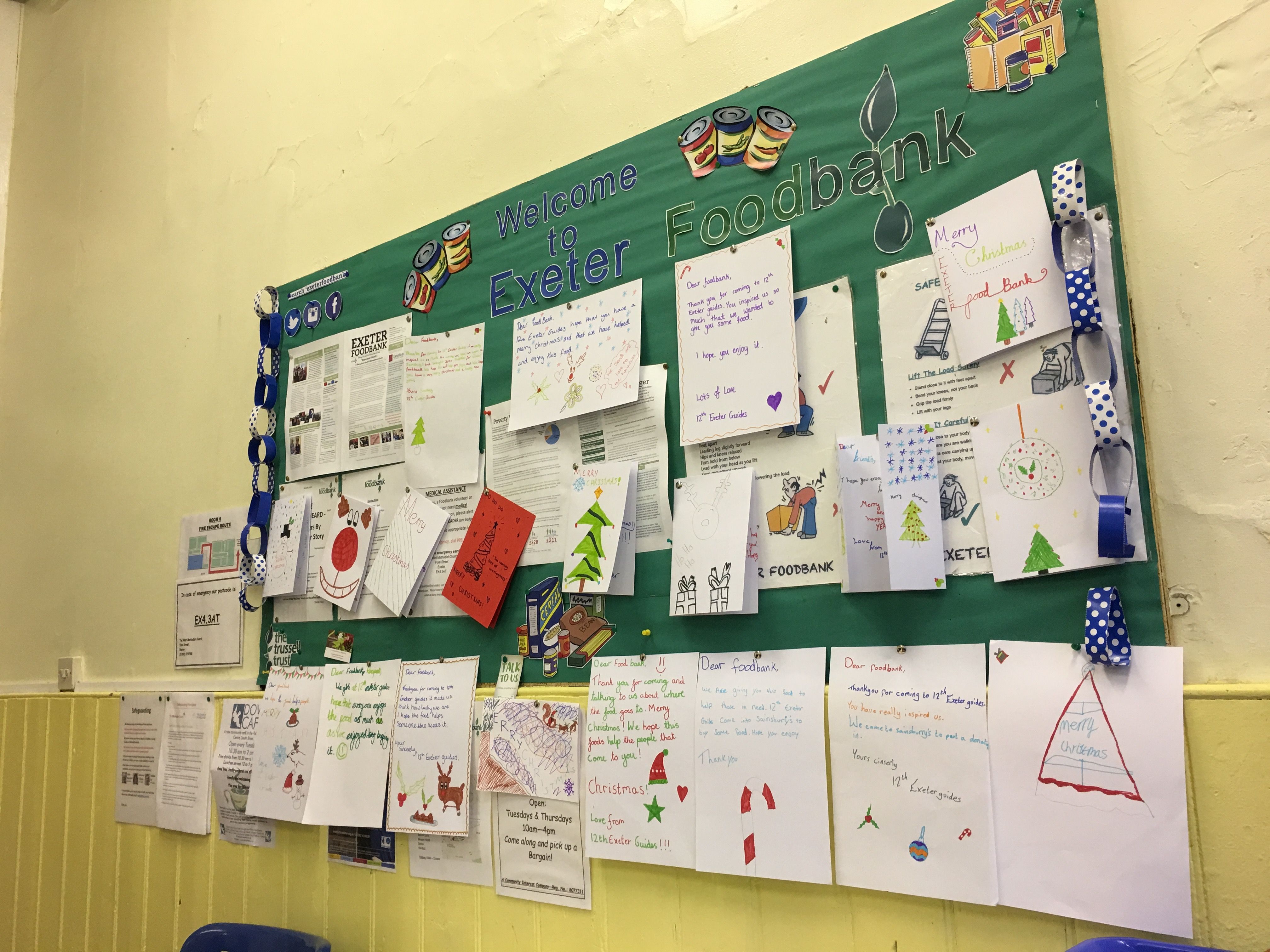 A recent talk by members of the Food Bank inspired Girl Guides to donate. The noticeboard is now covered with posters for support agencies and letters from the Girl Guides. Image by Caitlin Bawn. England, 2016.