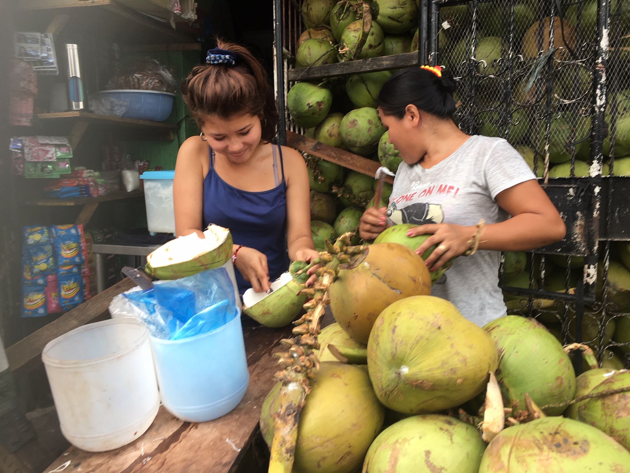 A coconut stand in Manila. The online gambling business is booming in the Philippines, but its many critics complain that rising rents and social problems caused by it are harming ordinary Filipinos. Image by Richard Bernstein. Philippines, 2020.