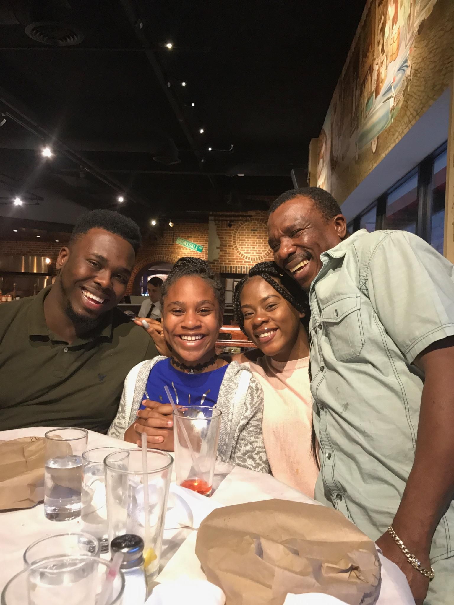 Errol Wray Jr. (left) with his two younger sisters and his dad Errol Wray Sr. during a family night out in New York City. Courtesy Errol Wray Jr.