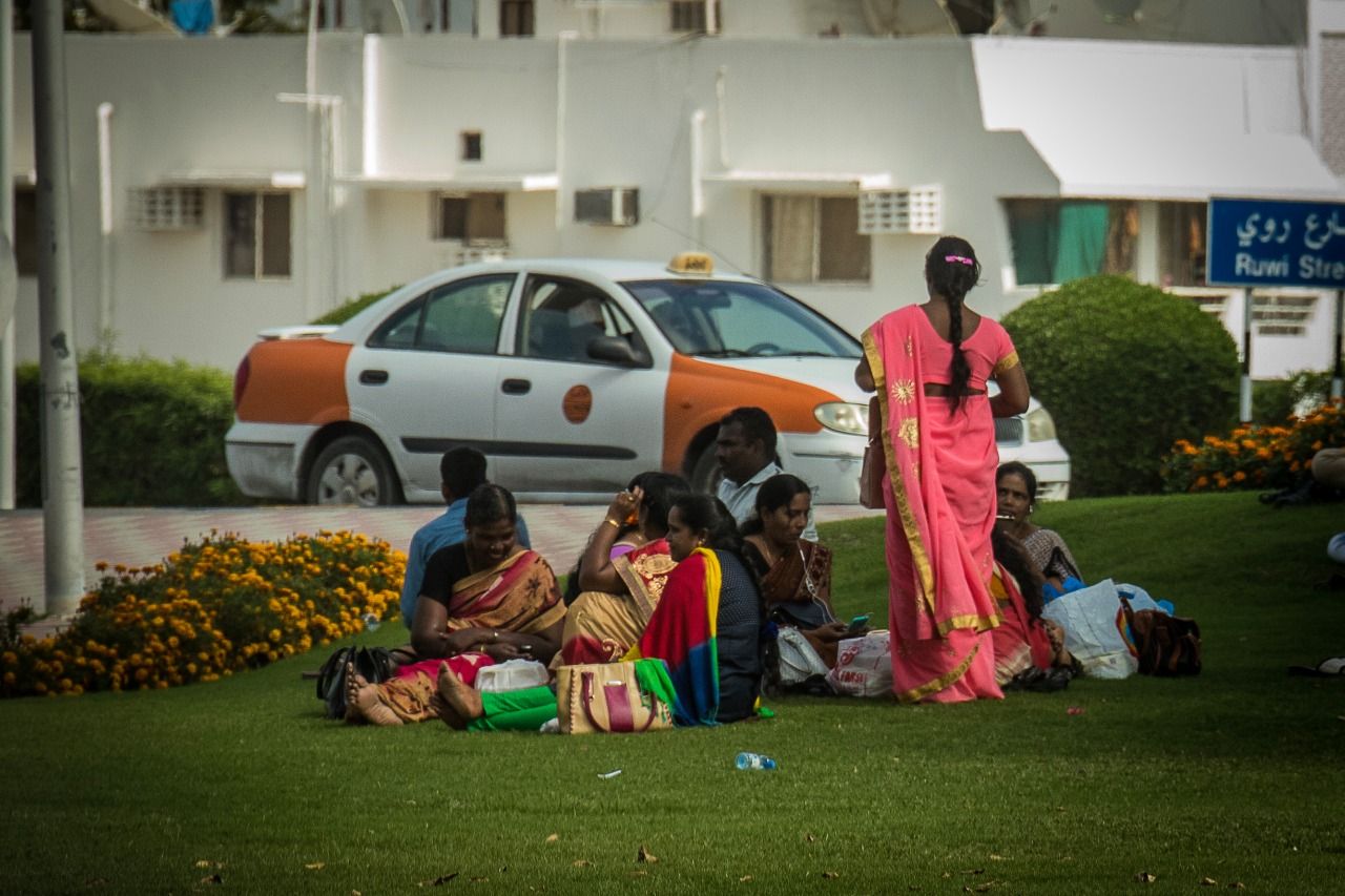 Indian and Sri Lankan domestic workers catch up with each other in a local park in Muscat. Image by Svanika Balasubramanian. Oman, 2019.