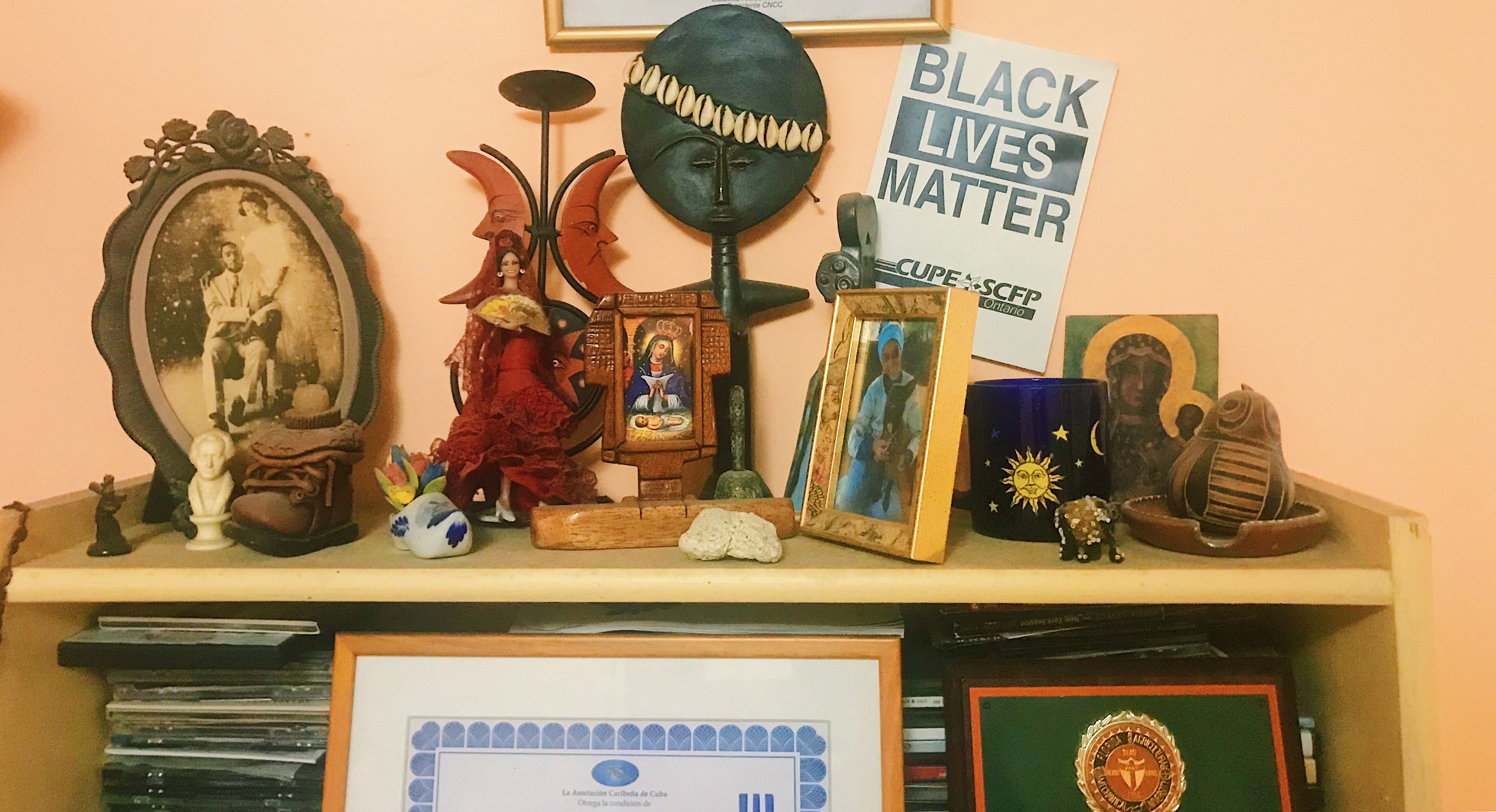 Black Lives Matter poster from a rally in Ontario, Canada, is displayed among some of documentary-filmmaker Gloria Rolando's possessions in Havana. Image by Esohe Osabuohien. Cuba, 2018. 