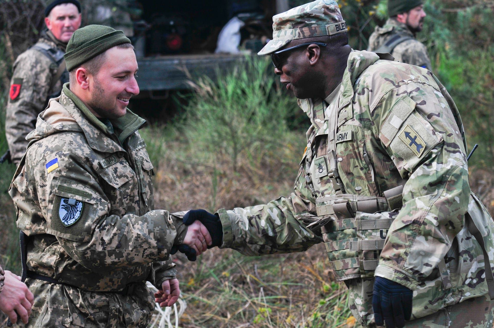 Staff Sgt. Michael Blevins, an adviser with Task Force Juvigny, greets his Armed Forces Ukraine counterparts during battalion training at the Combat Training Center–Yavoriv, Ukraine. Image by Cpl. Jared Saathoff / Wisconsin National Guard Public Affairs. Ukraine, 2020.