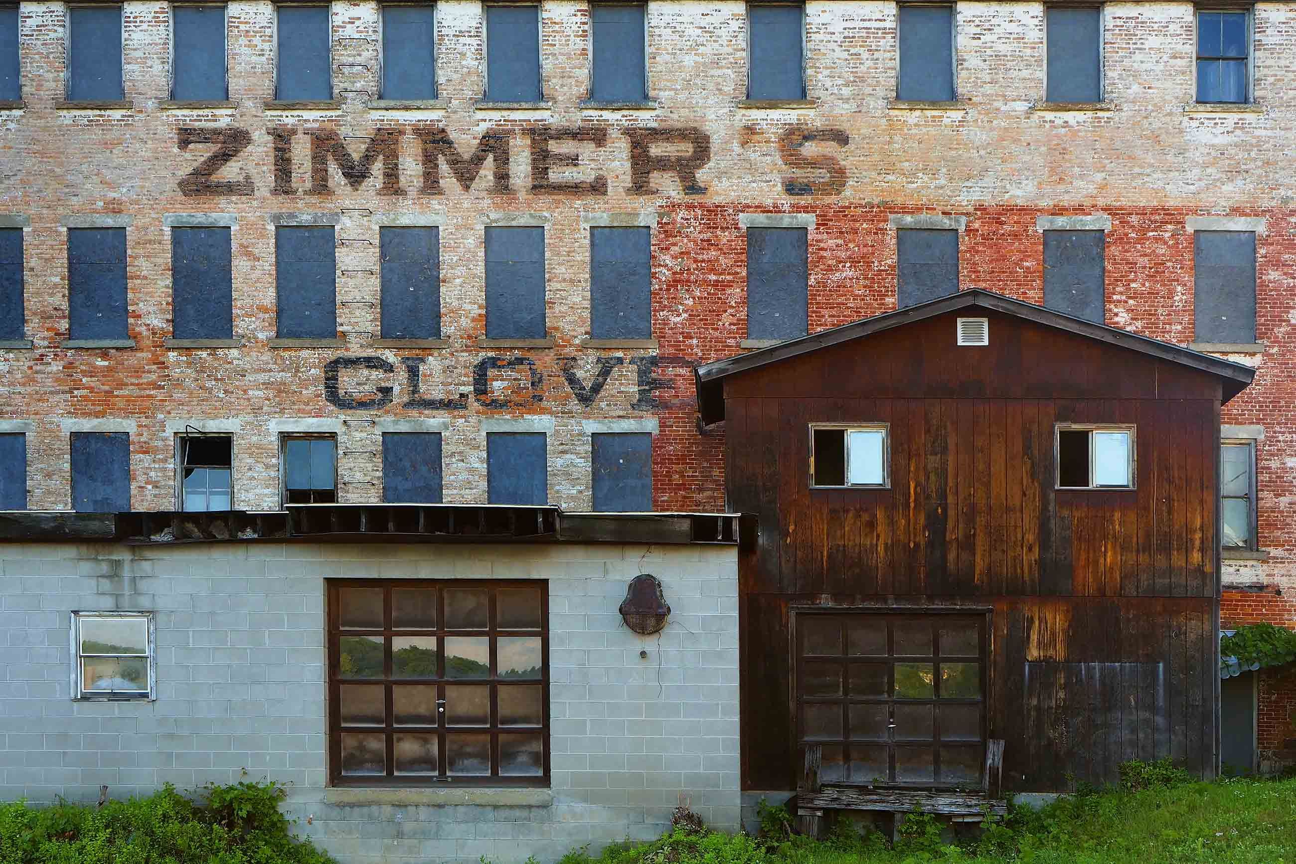 The ruins of the Zimmer and Son glove factory on South Arlington Avenue is a Gloversville, New York, landmark. For more than 100 years, leather tanning and glove making propelled the economy of this upstate New York town. Image by Larry C. Price. United States, 2016.