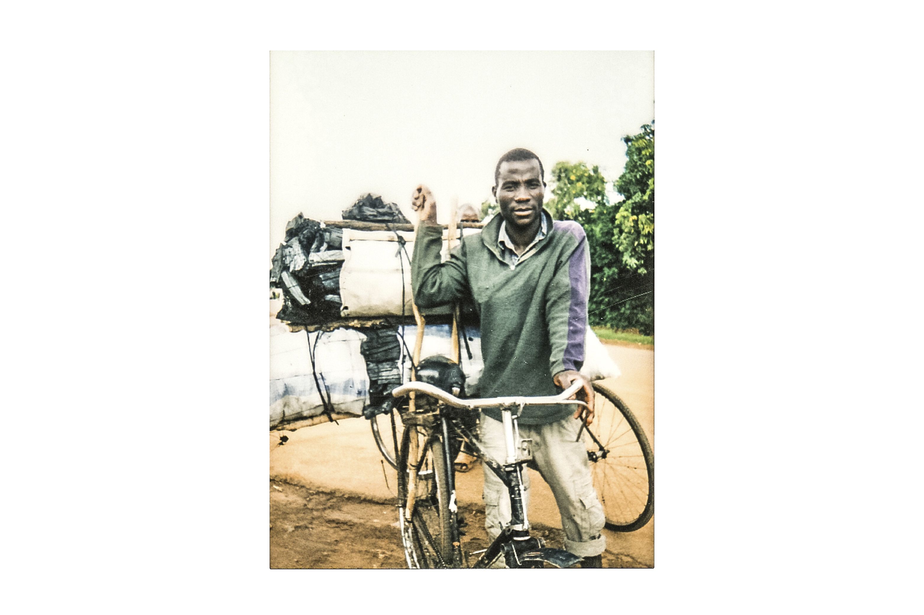 Handle Marino cycles around twelve hours from his village to Lilongwe and back to take up to 150 kilograms of charcoal to the city. Image by Nathalie Bertrams. Malawi, 2017.