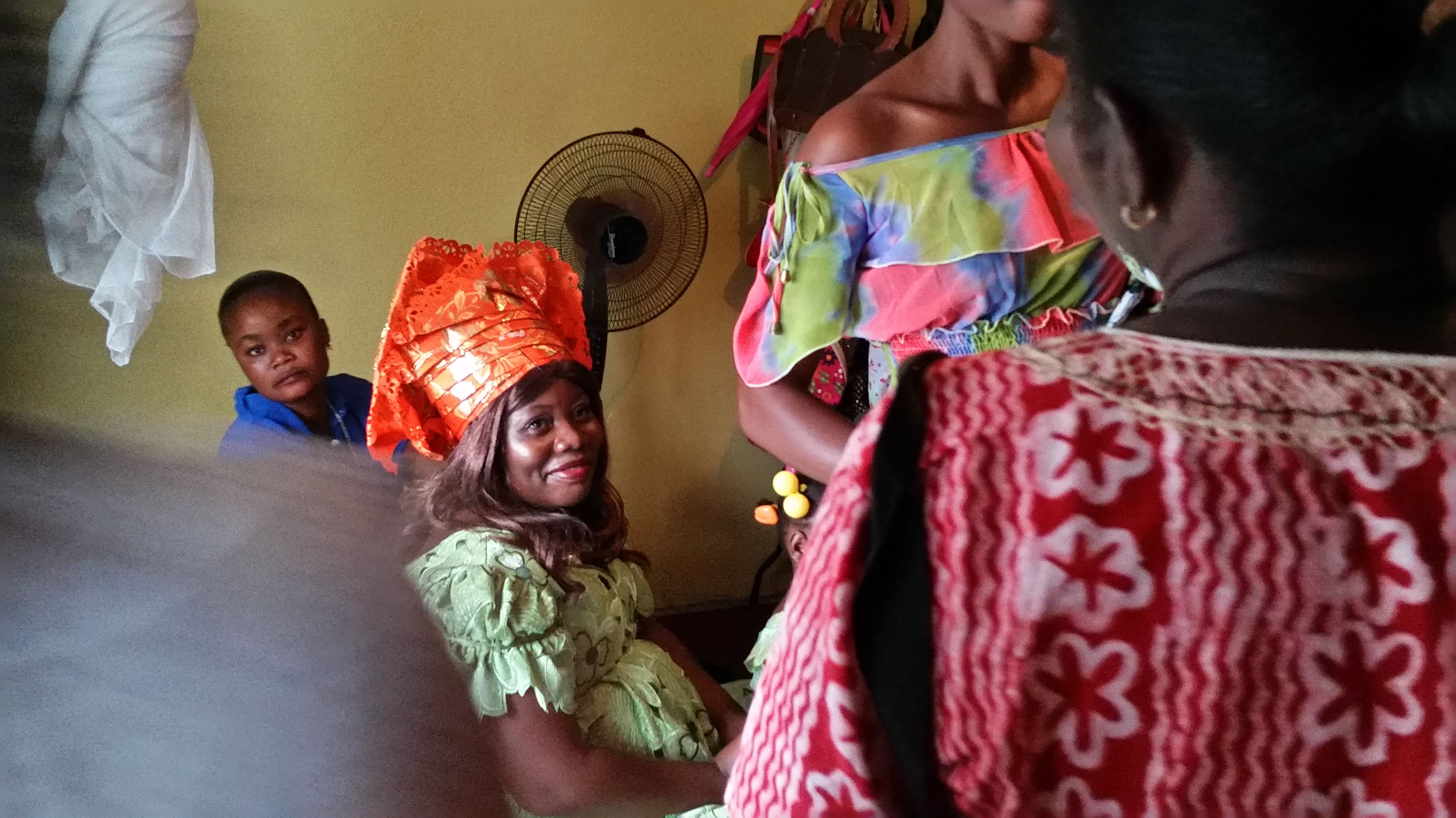 Salome Karwah, Ebola survivor and Ebola nurse, waits in her sister's bedroom on her wedding day as her aunts ask the groom's family for money, in a Liberian tradition known as Bride Price. In February 2017 she died from complications during childbirth. Image by Seema Yasmin. Liberia, 2015.