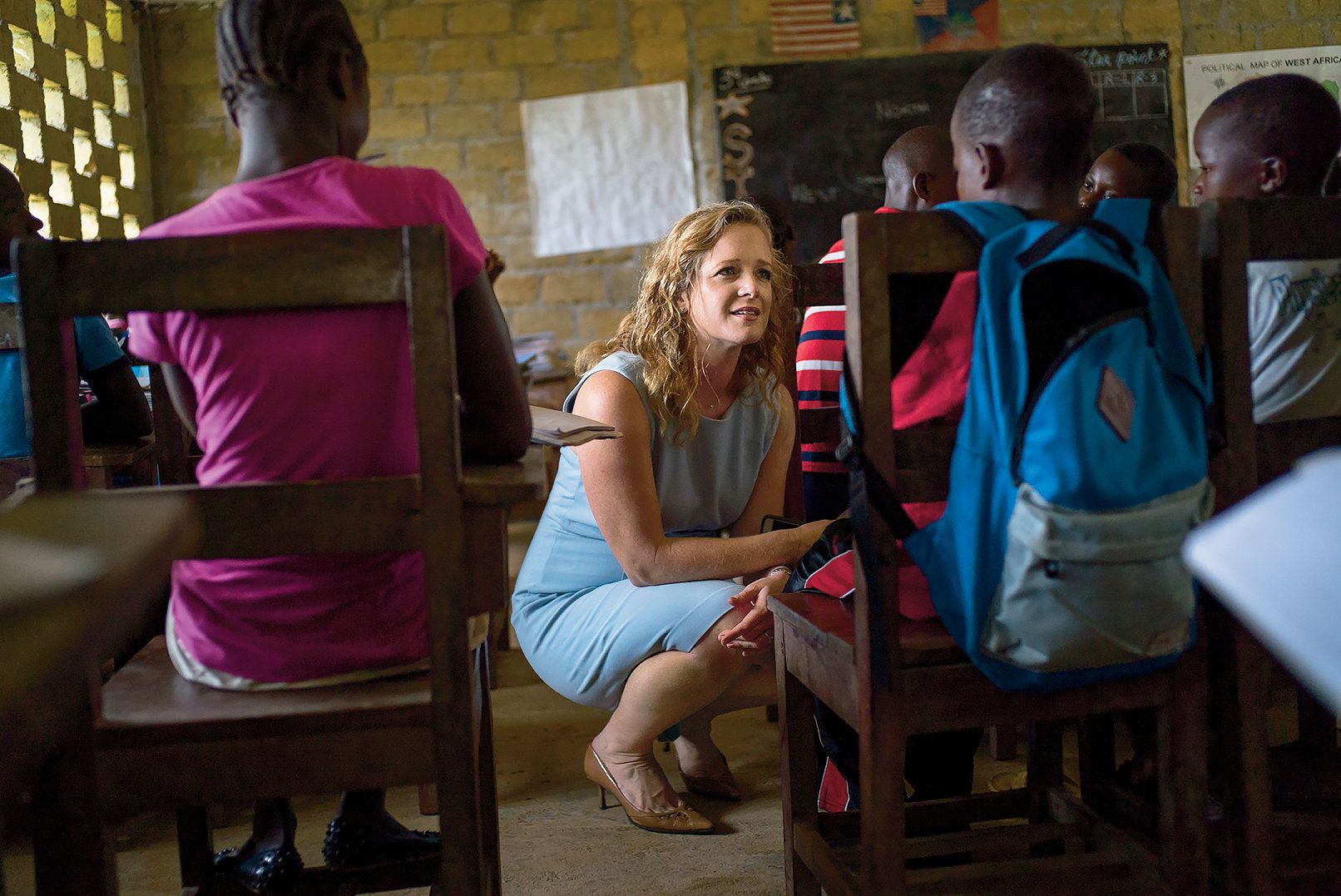 Shannon May, a Bridge founder, at one of its Liberian schools. The company has been hired by the Liberian government to run schools in its struggling public-education system. Image by Diana Zeyneb Alhindawi for The New York Times. Liberia, 2017.