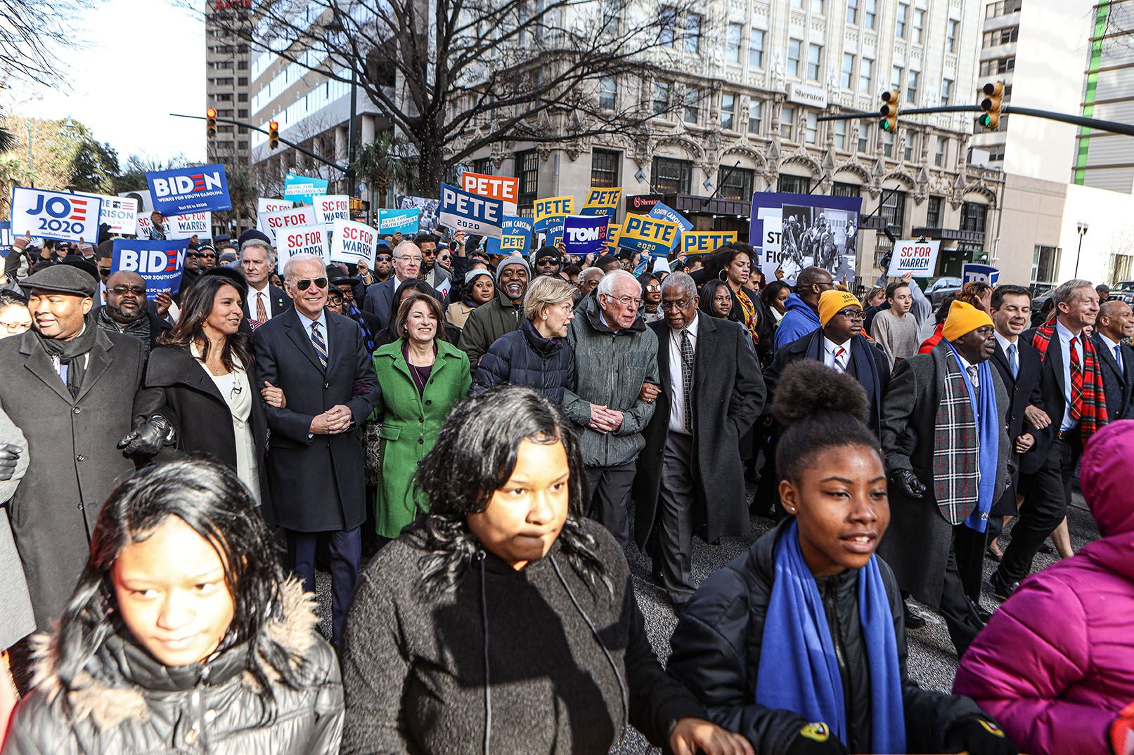 Democratic candidates for president march at King Day at The Dome Rally in Columbia, South Carolina a month before the "First in the South" primary election. Image by Perry McLeod / Shutterstock. United States, 2020.