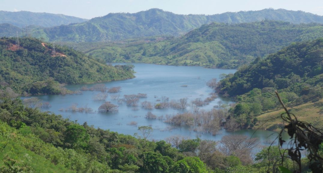 The reservoir created by the Barro Blanco hydroelectric dam extends miles upstream, flooding houses and farmland of the Ngäbe-Buglé people.