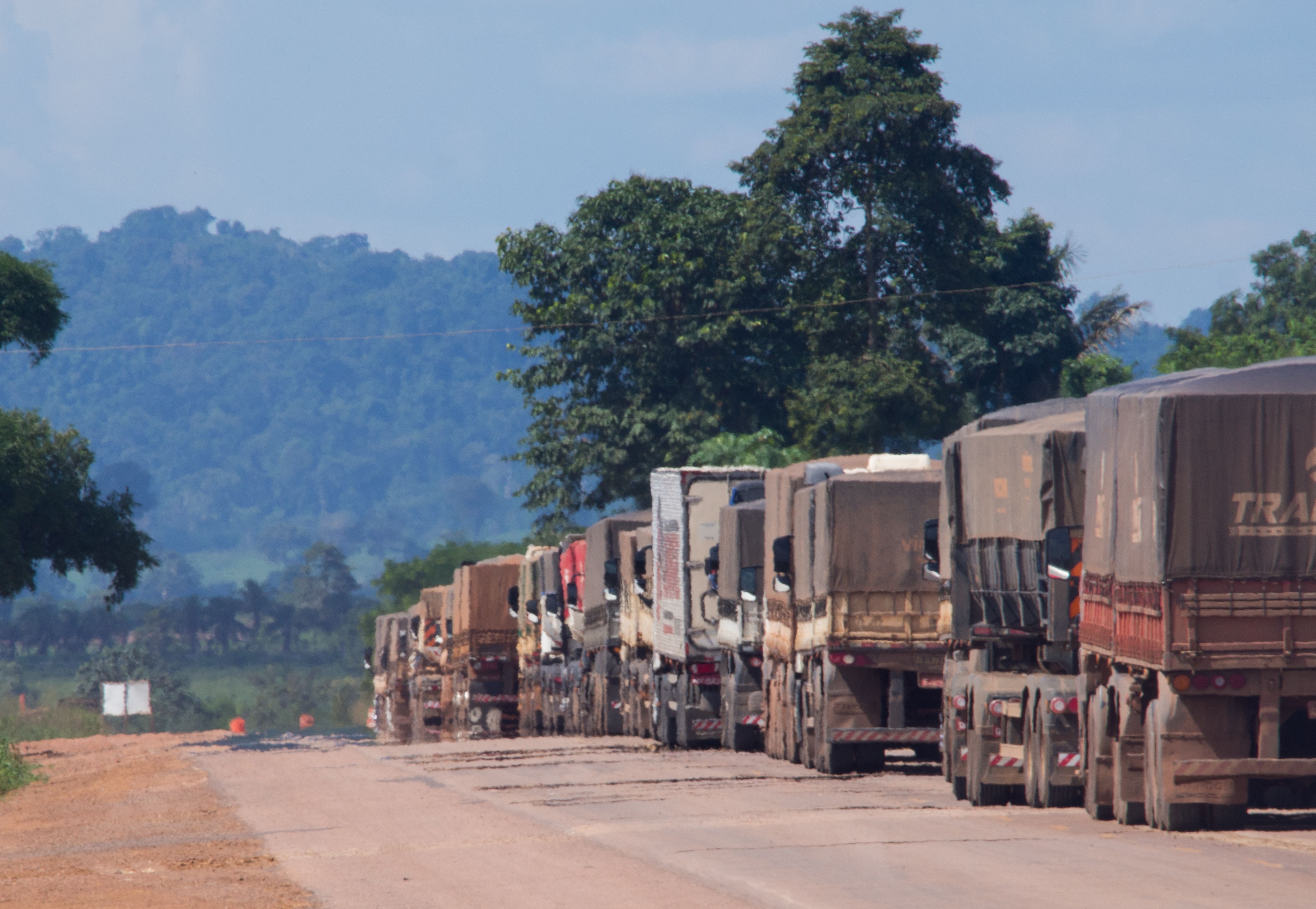 Trucks carry soy, corn, and beef along one of the main highways cutting across the Amazon basin. Much of these food commodities are bound for China. Image by Heriberto Araújo. Brazil, 2019.