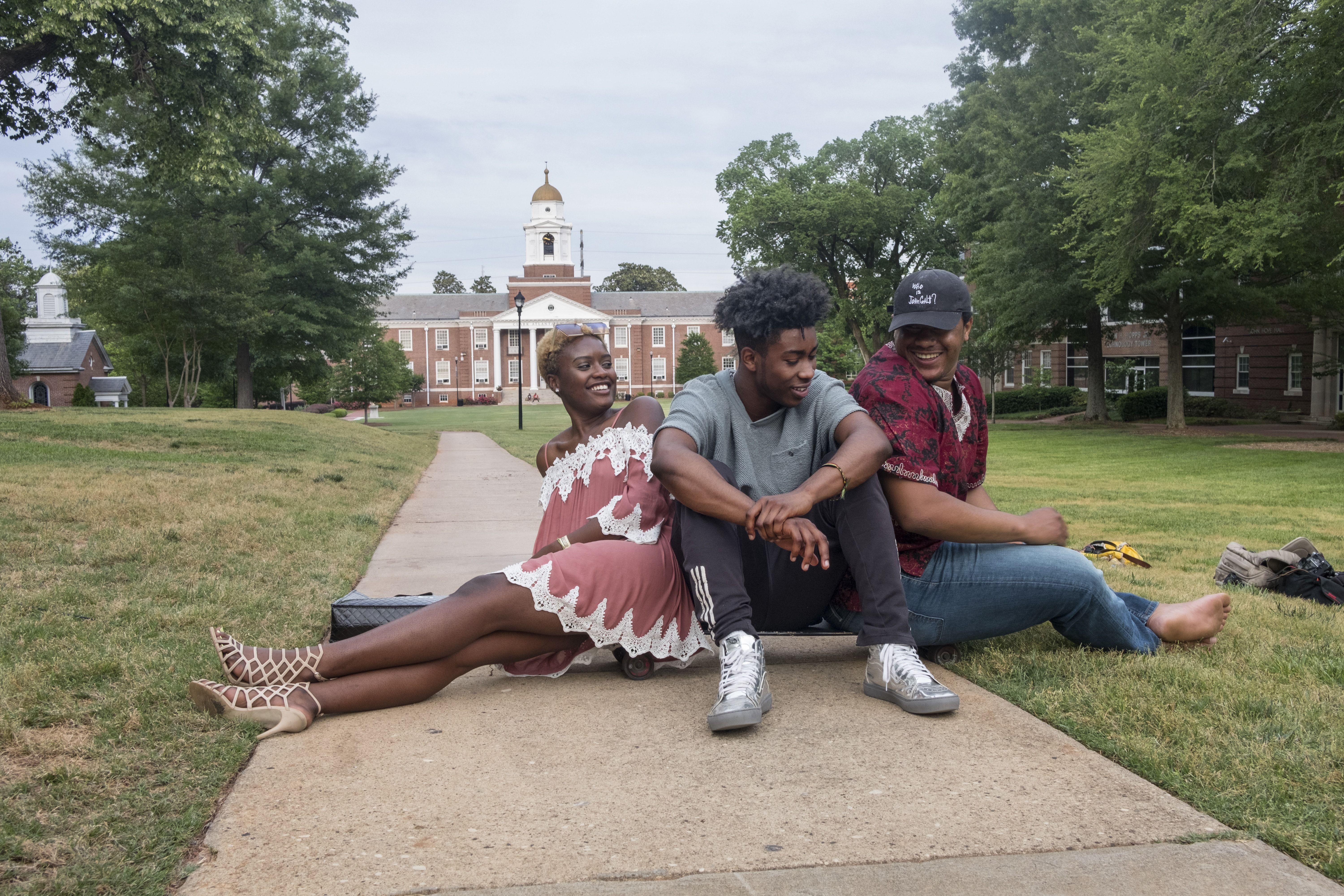 The Atlanta University Center’s campuses adjoin. Spelman student DeJah Ault, with Gerard Contee from Morehouse and Khalil Pickering from Clark Atlanta, says, “It doesn’t feel like we go to separate schools.” Image by Radcliffe "Ruddy" Roye. United States, 2017.
