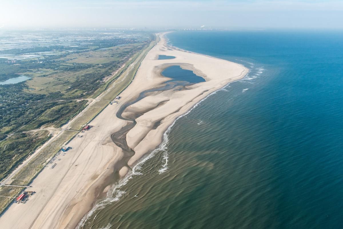 The Sand Motor project used natural forces to spread sand to protect a portion of the Dutch coast. Image by Rijkswaterstaat. The Netherlands, 2020.