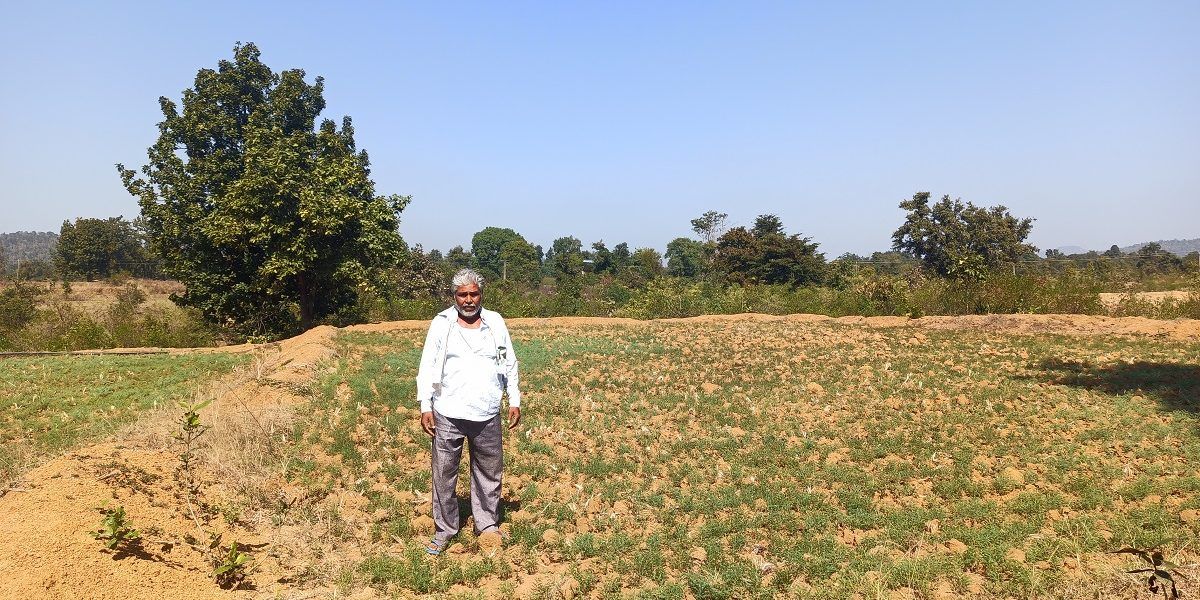 55-year old Ramsingh Nagvanshi, a Dalit farmer, at his farm. His family has cultivated the land for generations, but has no land title because it falls under orange areas. Image by Nihar Gokhale. India, undated.