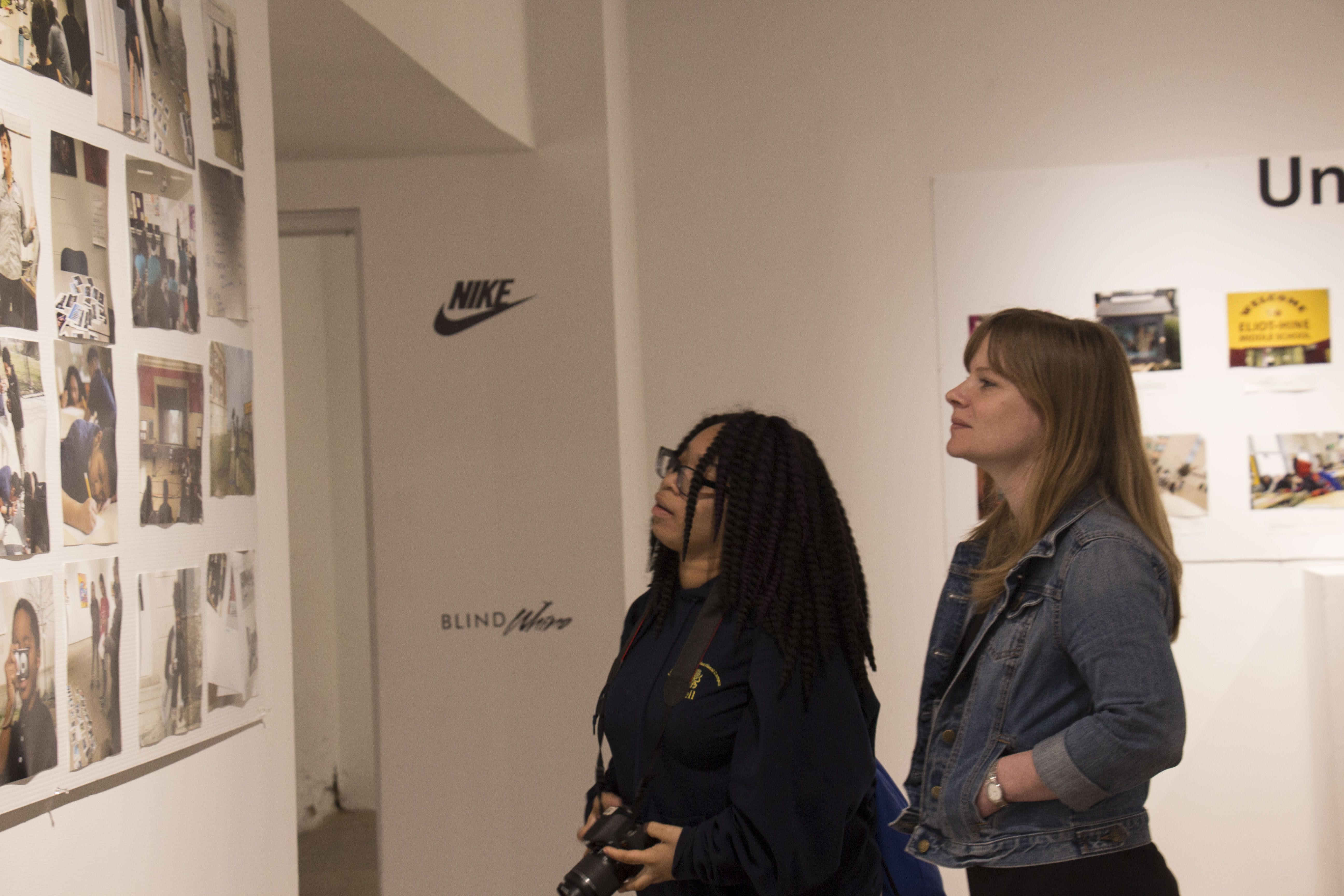 A student and teacher from Columbia Heights Educational Campus explore the Everyday DC exhibition. Image by Ifath Sayed. United States, 2017. 