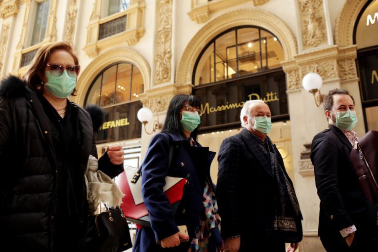 Tourists in face masks at the Wiktor Emanuel II Gallery in Italy. Image by Praszkiewicz / Shutterstock. Italy, 2020.