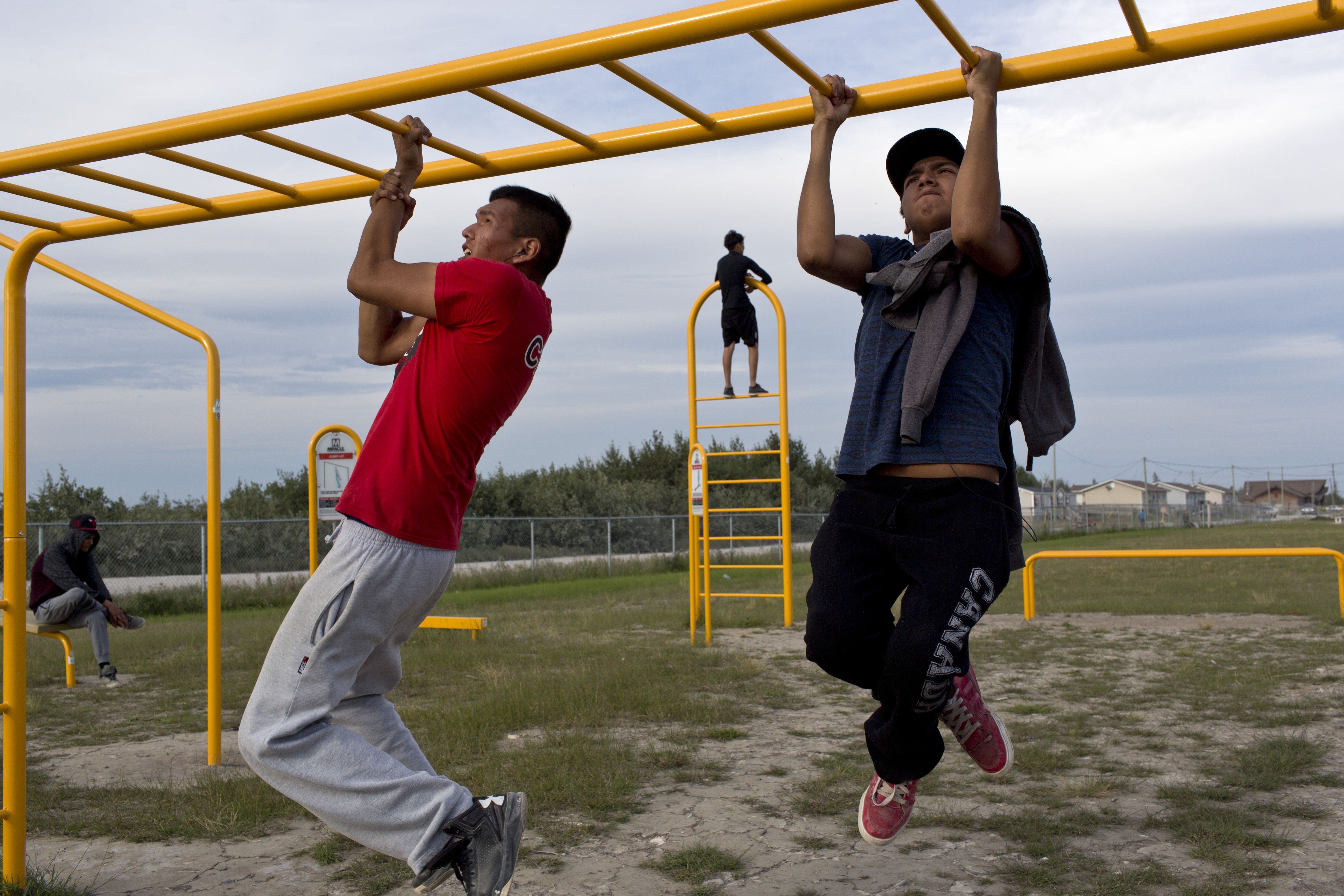 I was confronted on a regular basis by images of members of the Attawpiskat First Nation in a context that we are not used to seeing in the media. This particular group of young men were at the outdoor playground most days exercising and doing good things for their bodies. It would be irresponsible to overlook the problems that exist in Attawapiskat, but the traditional narrative attached to young First Nations men has typically overlooked positive outcomes and focused only on negativity, which in turn feeds a stereotype that presents low expectations for them. Image by David Maurice Smith. Canada, 2016.