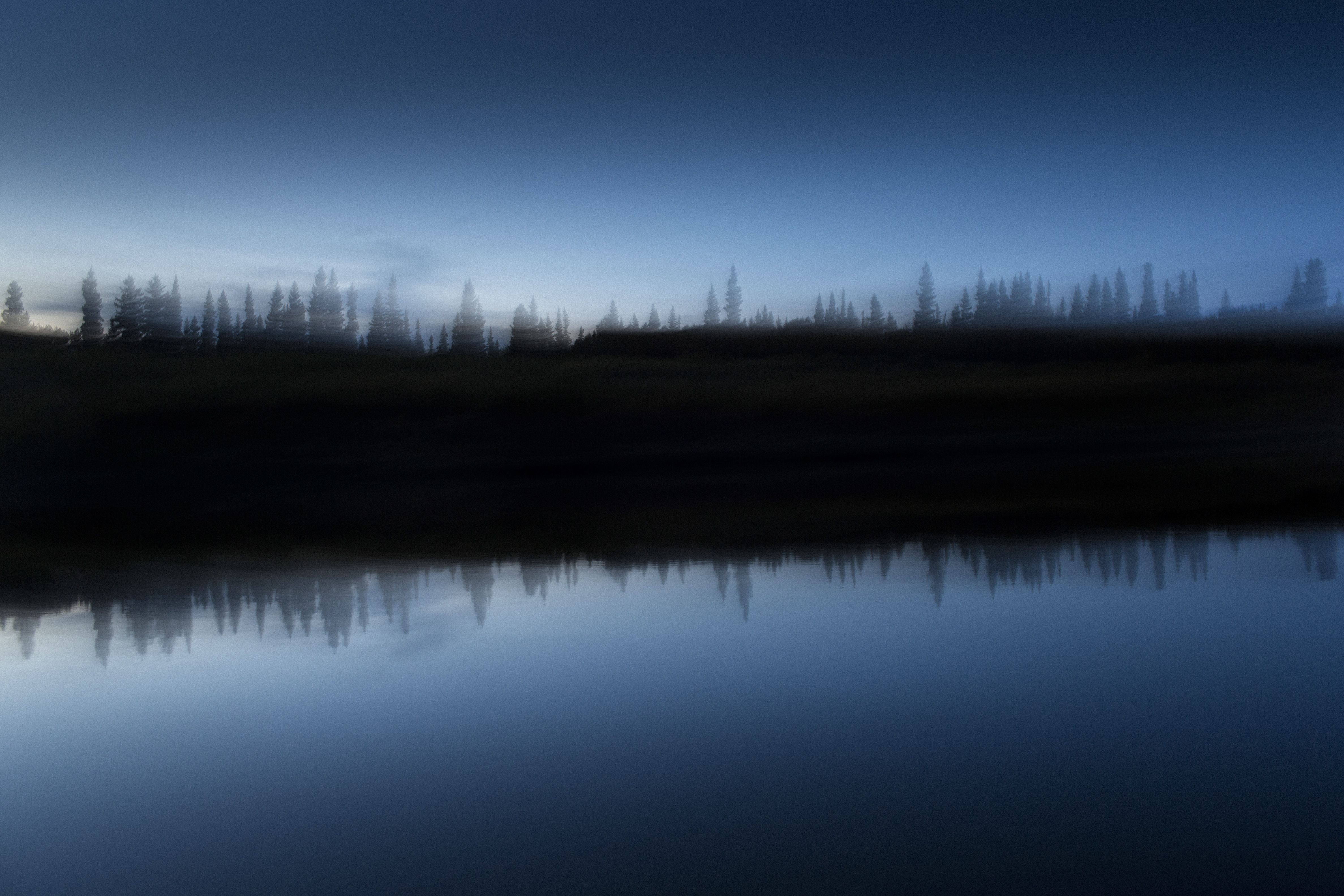 The Attawapiskat river at dusk. The river is a central part of cultural life for the Cree of Attawapiskat, having provided them with food, transportation and recreation for generations. The word Attawapiskat translates to “People of the Parting Rocks,” in reference to a distinct rock formation found several kilometres up river. Image by David Maurice Smith. Canada, 2016.