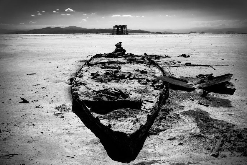 The remains of a boat on the dried-out seabed of Lake Urmia, the port of Sharafghaneh. Drought has impacted tourism to the city. Image by Ako Salemi. Iran, 2016.