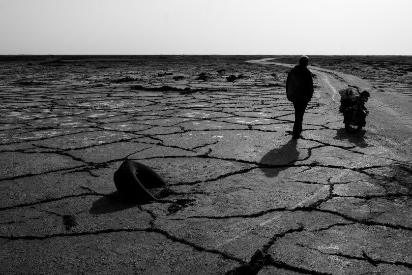 Cracked land of the Gavkhouni salt marsh, the terminal basin of the Zayandeh River in Isfahan Province, Iran. Droughts and water mismanagement have contributed to Iran's water crisis. Image by Ako Salemi. Iran, 2016.