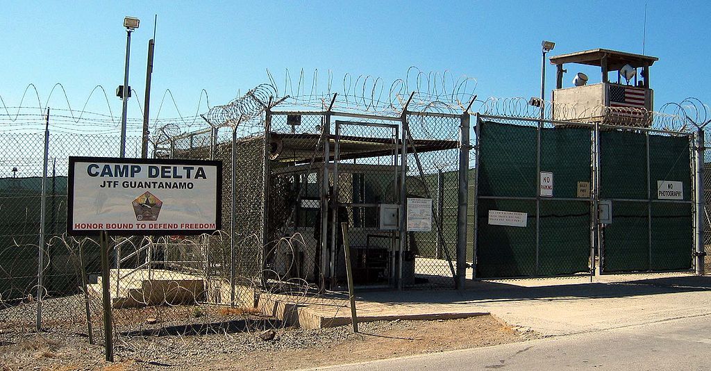 The entrance to Camp 1 in Guantanamo Bay's Camp Delta. The base's detention camps are numbered based on the order in which they were built, not their order of precedence or level of security. Image by Kathleen T. Rhem/Wikimedia Commons. Cuba, 2005.