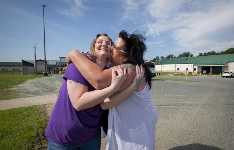 Tera Crowder hugs her mother Deborah after being released from the Fluvanna Correctional Center for Women in June 2019. Image by Julia Rendleman. United States, 2019.