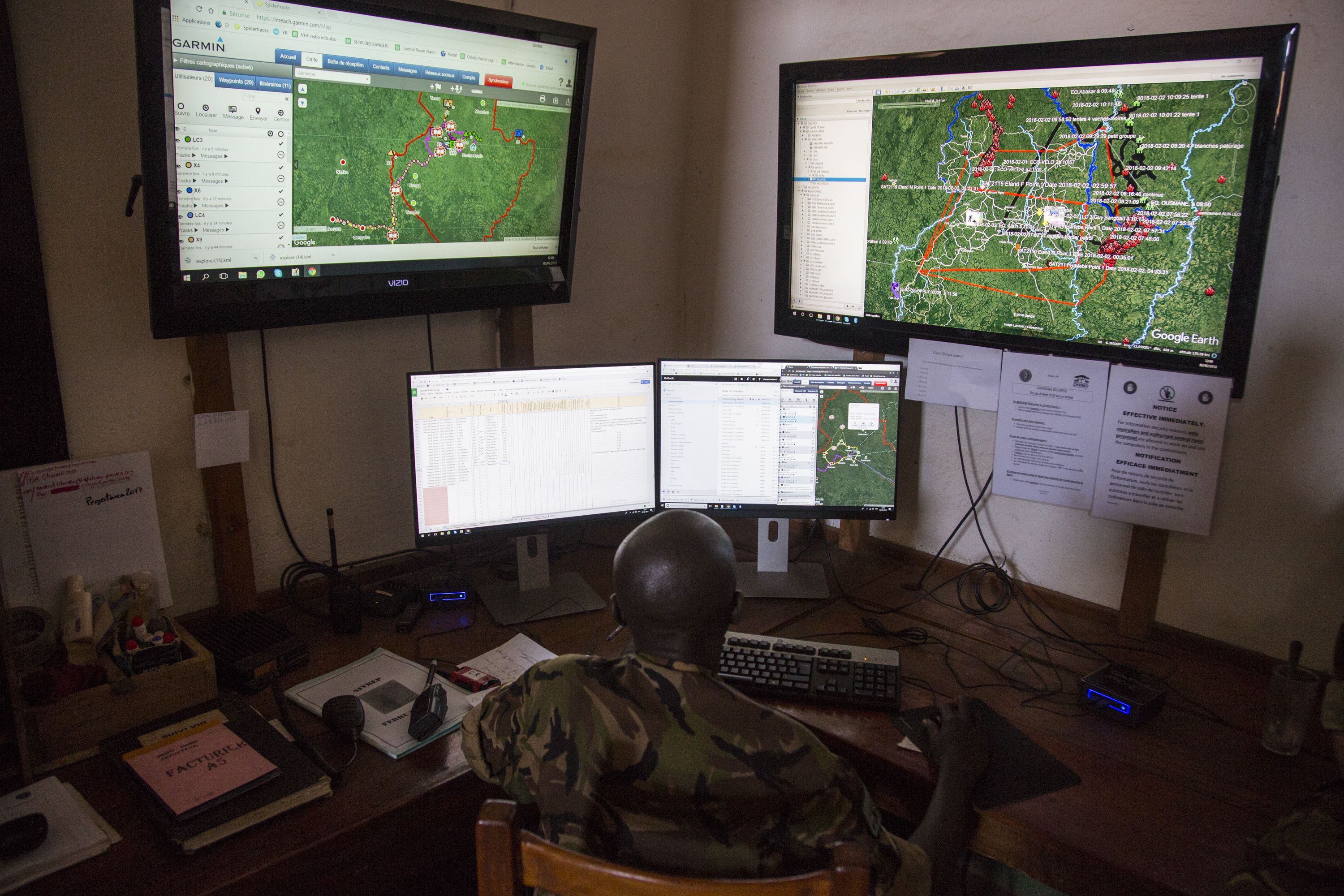 Inside the park’s control room, where software plots ranger movement, bush fires and other crucial information on a Google Earth map. Image by Jack Losh. Central African Republic, 2018.
