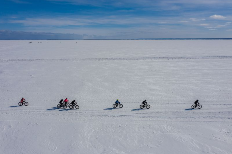 The fat tire bike race across the frozen surface of Lake Superior on Chequamegon Bay in Washburn, Wisconsin, takes place on Feb. 16, 2020. The 20K race is one of Wisconsin's most unique fat bike races, bringing about 100 participants. Image by Zbigniew Bzdak/The Chicago Tribune. United States, 2020.