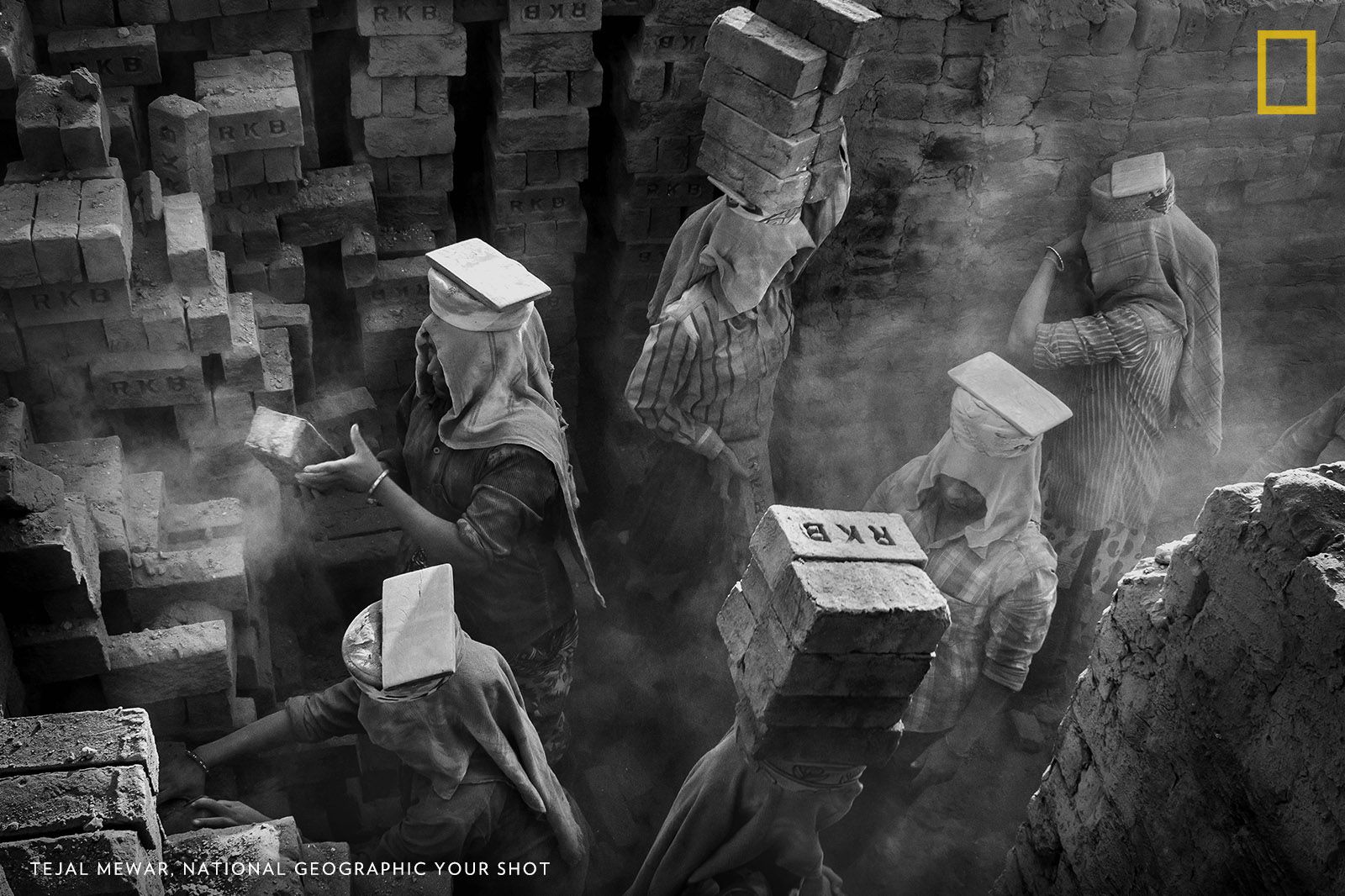 This picture was taken at a brick kiln where the women were transferring bricks from the kiln to the truck. These females were carrying almost 10-12 bricks, all together on their head. The working conditions was quite tough. Dust was making breathing even difficult. Here I have tried to showcase that like males, females also can do the work in which physical strength is required. Image by Tejal Mewar.