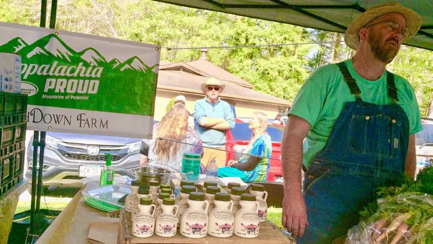 SouthDown Farm’s Seth Long sells Kentucky maple syrup at Cowan Farmers Market. Image by Richie Davis. United States, 2018.