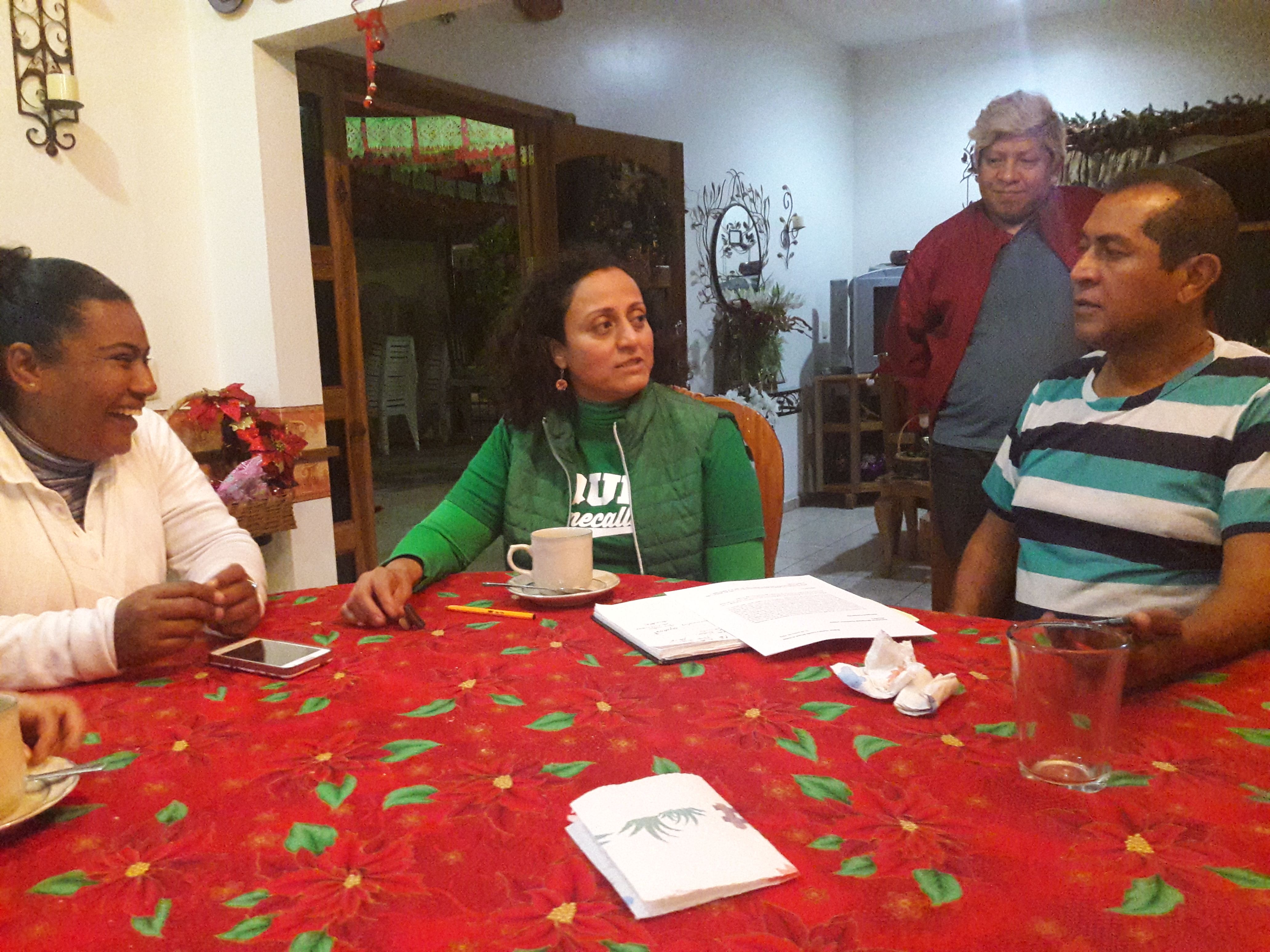 Laughs are shared in a discussion about an upcoming consultation forum, which successfully took place on Feb. 16, for the official recognition of Mata Clara as an Afro-Mexican town. Rosa María Hernández Fitta (center) is one of the forum’s main organizers. From Left to Right: Raquel Peña Virgen, Rosa María Fitta Hernández, Edgar Merino, Efrain Blanco Vera. Image by Jonathan Custodio. Mexico, 2018.