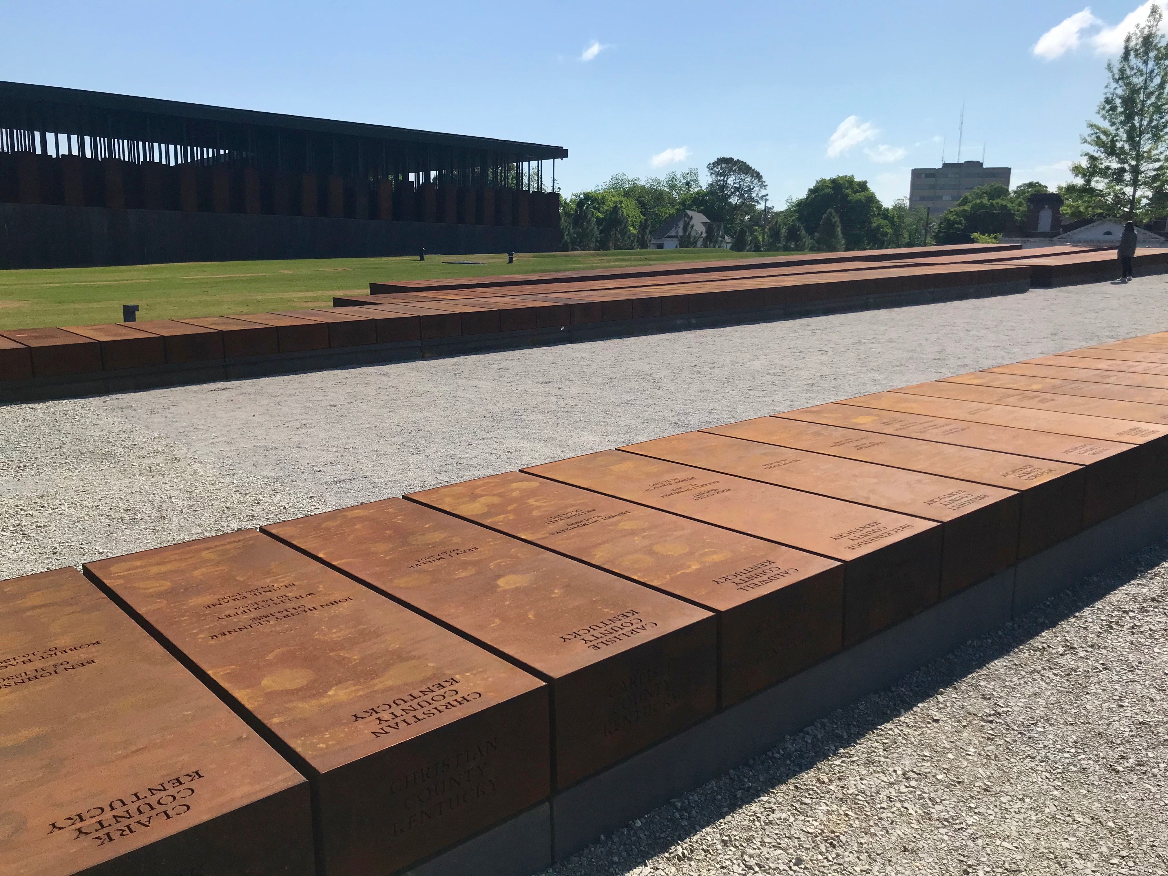 Weathered steel slabs, one for each county where lynchings occurred, available to share with each of the counties involved, at the National Memorial for Peace and Justice. Image by Jon Sawyer. United States, 2018.