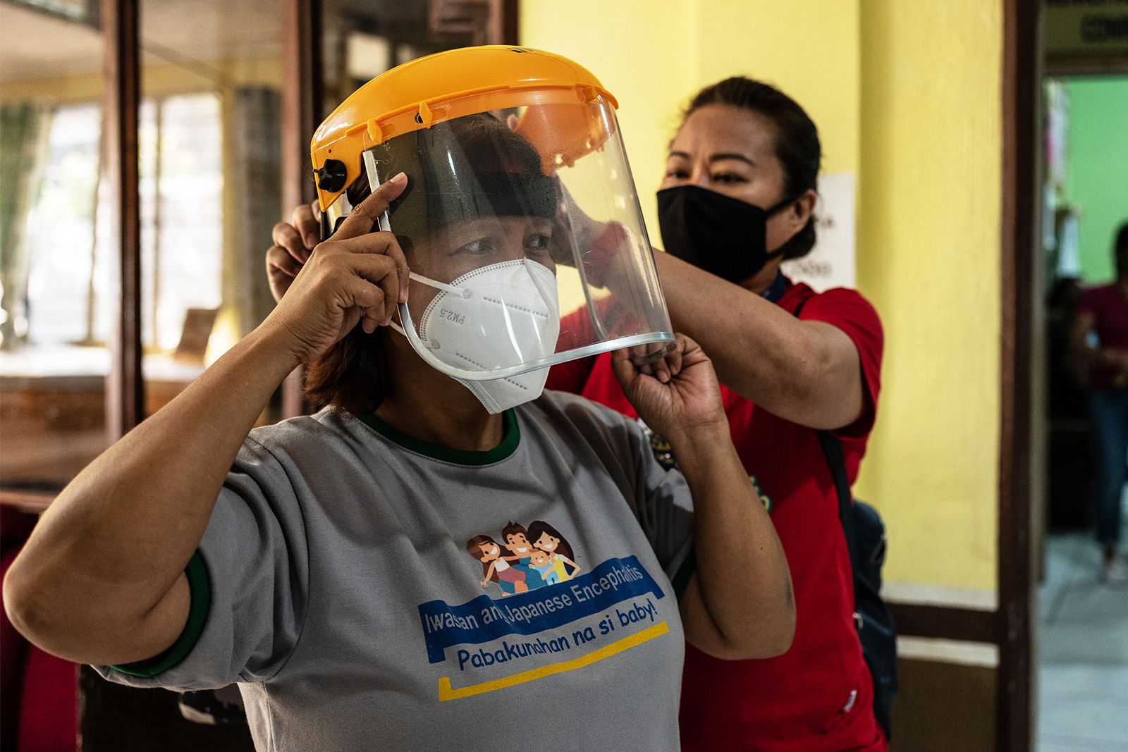 Some medics are using helmets designed for use on construction sites. Image by Xyza Cruz Bacani. Philippines, 2020.