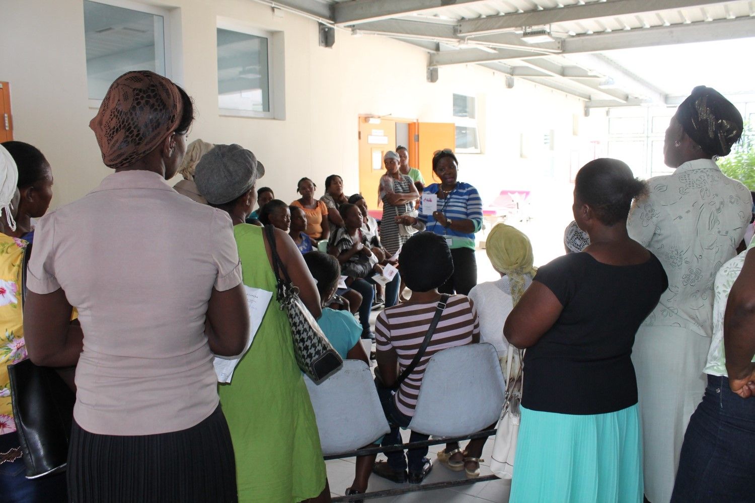 The health educator, Holdie, explains risk factors of cervical cancer to the group of women. For most women here, this is the first time they have been exposed to this information. Many people in Haiti believe that cervical cancer comes from being unclean or promiscuous. Cervical cancer is caused by the human papilloma virus (HPV). One study estimated that one in five Haitian women had the cancerous form of HPV. This can shock women because of strongly held beliefs about who gets cervical cancer and why. Image by Anna Russell. Haiti, 2017.