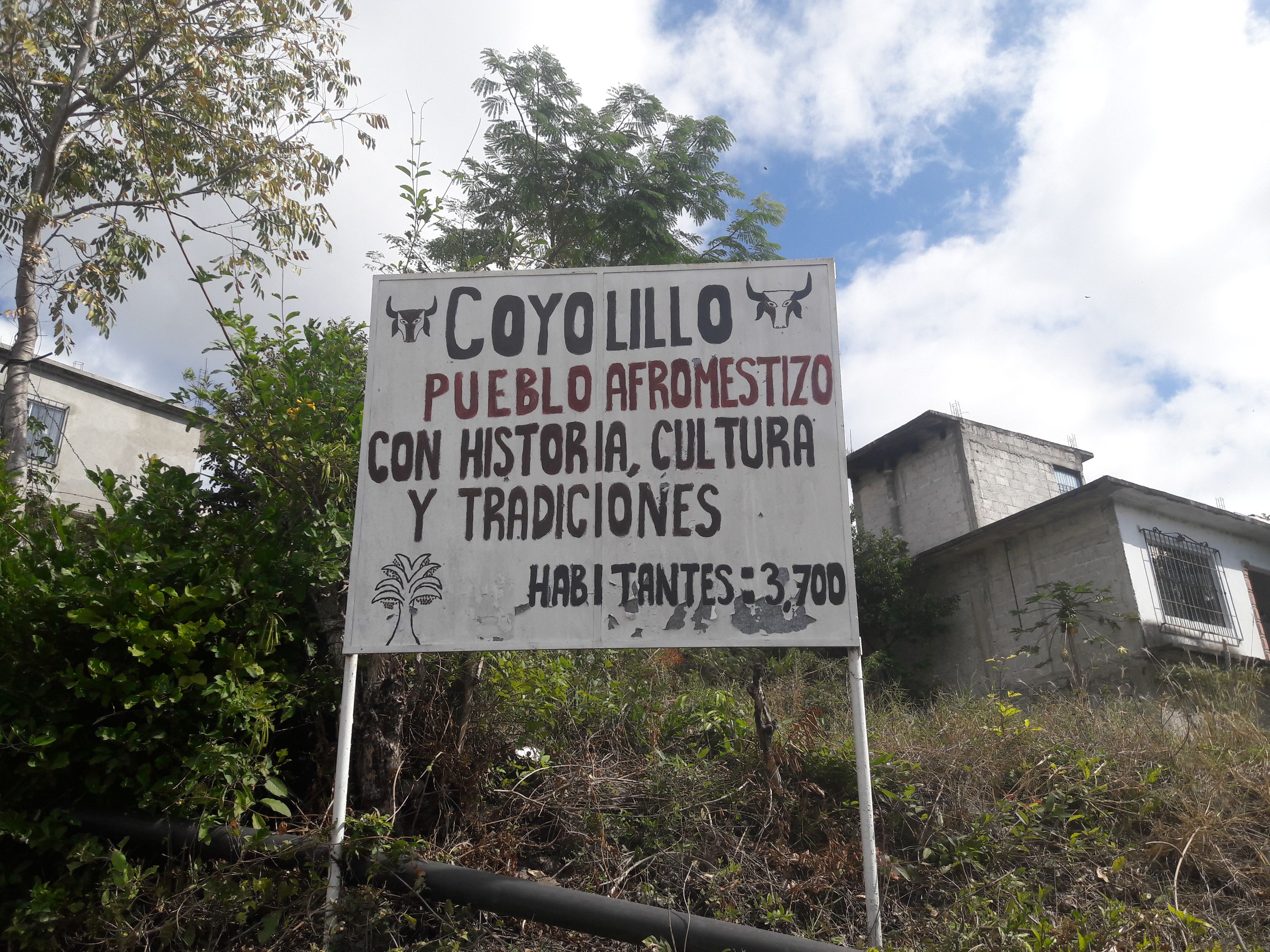 This sign welcomes newcomers and residents into the Afro-Mestizo town. Shadowing Coyolillo at the top are depictions of a bull's head, its mascot. Image by Jonathan Custodio. Mexico, 2018.