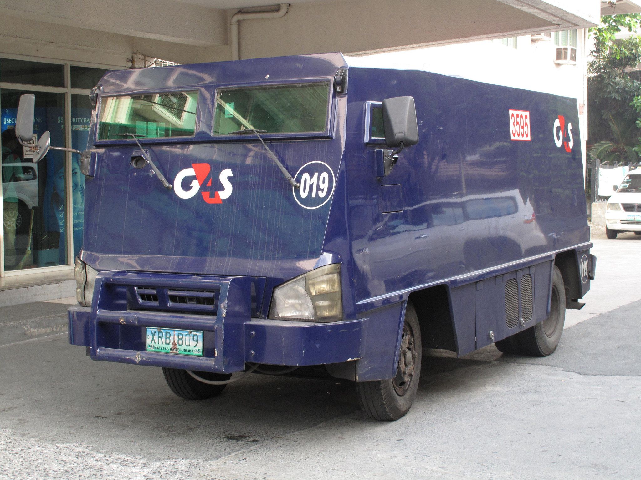 Isuzu armored truck. Flickr commons image by Davocarno. Philippines, 2014.