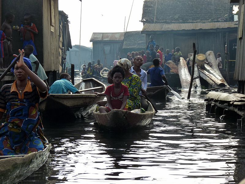 Boats traverse a canal in Makoko, Nigeria. Image by Heinrich-Böll-Stiftung / Wikimedia Commons. Nigeria, 2010. 