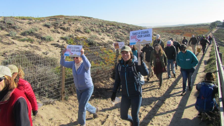 Protesters against beach sand mining near Monterey, California, head to the site of the mine. Image by Adara Shilling. United States, 2017.