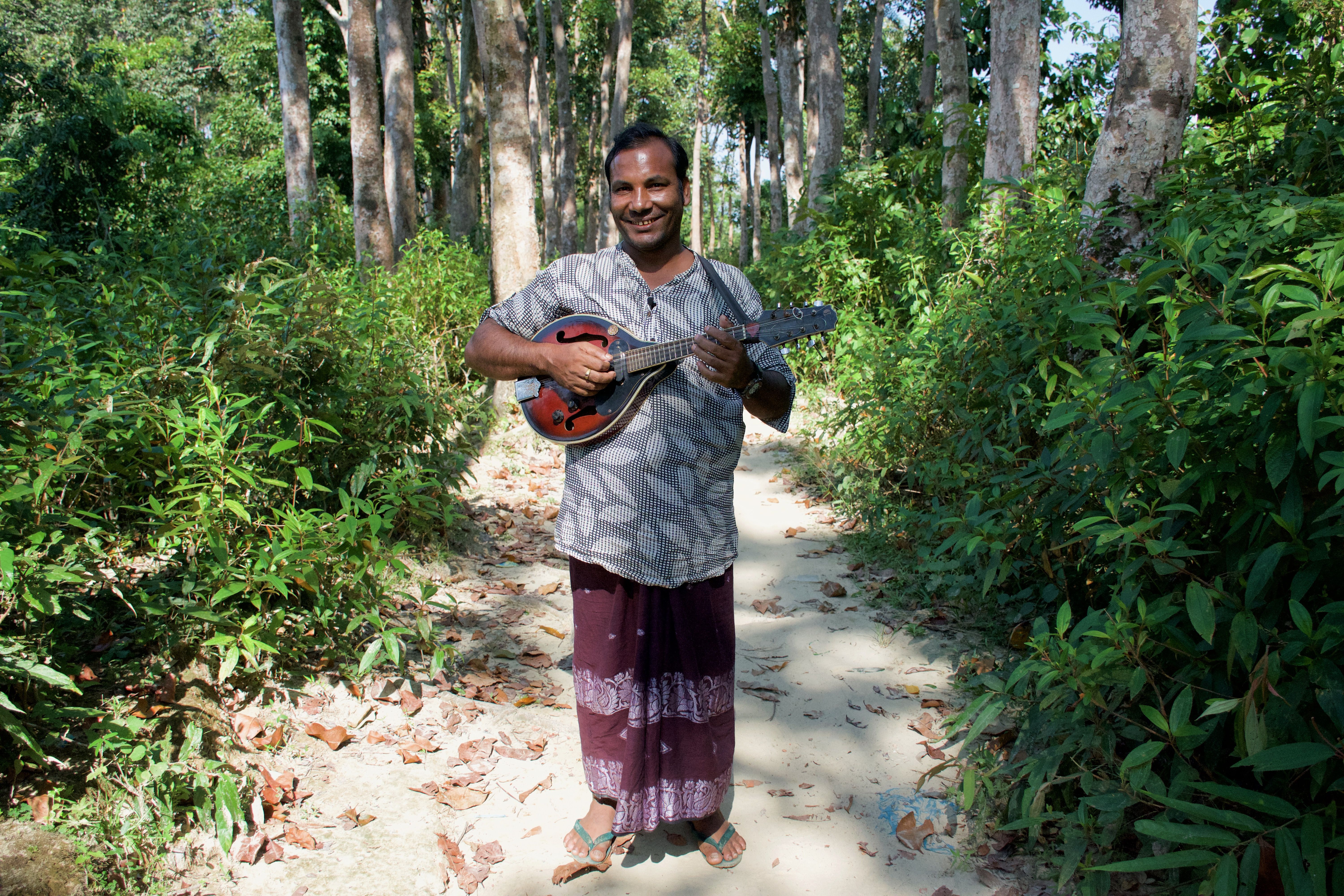 Soyedul Amin used to play music at weddings in Myanmar. He fled after being beaten and imprisoned. Image by Sasha Ingber. Bangladesh, 2019.